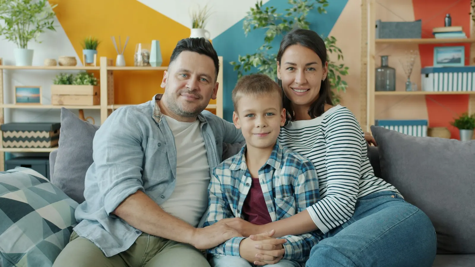 Parents and their young child spending time together at home